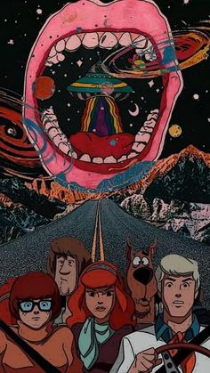 an image of people riding on the back of a car in front of a giant mouth