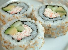 sushi rolls with avocado and sesame seeds