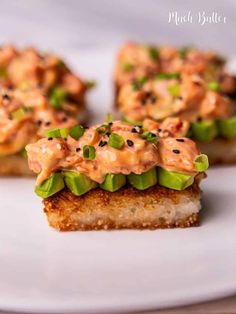 small pieces of food on a white plate