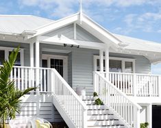 a white house with steps leading up to it