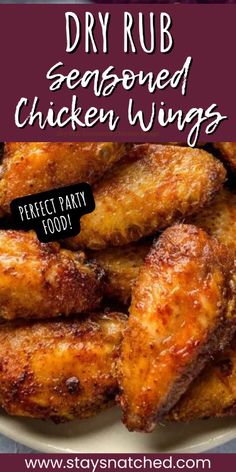 fried chicken wings on a plate with text overlay that reads dry rub seasoned chicken wings perfect party food