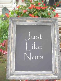 a chalkboard sign that says just like nora