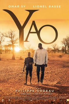 the movie poster for yao with two men walking in front of an orange sunset