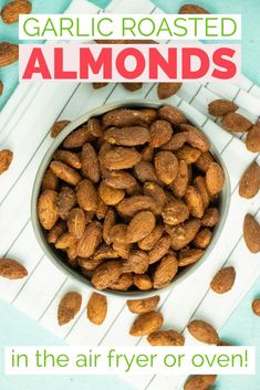 a bowl filled with almonds sitting on top of a table