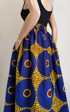 Handmade Unlined African Print Midi Skirt     Elastic waist band skirt at the back      2 open side-entry pockets     Exact length: 33"      100% Wax Cotton     Handmade     Made in the UK (Colours may vary due to lighting on images. The product images are closest to the true colour of the product.) Fitted High Waist Maxi Skirt With Pockets, Fitted Long Skirt With Pockets, Fitted Blue Skirt With Pockets, Blue Fitted Skirt With Pockets, Flowy Long Skirt With Side Pockets, Fitted Midi Skirt With Pockets, Blue Midi Skirt With Pockets, Blue Skirt With Side Pockets, Fitted Flared Maxi Skirt With Pockets