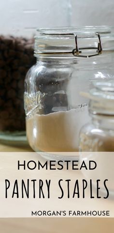 jars filled with pantry staples on top of a wooden table