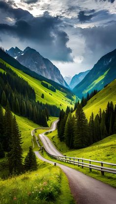 a scenic road winding through a lush green valley