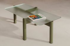 a table that has a book on it