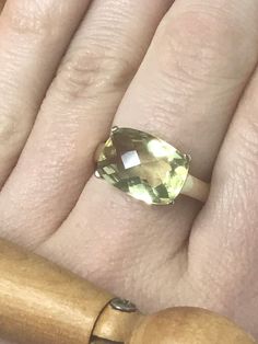 This is a truly stunning ring.  It is a lovely vintage ring made in England in the 70's.  This looks beautiful on and catches the light beautifully.  The stone is citrine with an even colour throughout.  This is hallmarked London England in a 9ct setting.  This ring is a size O If you have any questions then please feel free to ask.  4.49g *Alterations* Nearly everything is possible to have altered so please ask if there is something you need resizing. This usually takes about a week and will usually cost up to £35.  *Gift wrapping* All items are beautifully gift wrapped in repurposed wrapping and vintage boxes. The only thing not reused is the sellotape. If there is a certain colour you don't like then please say. There will be no receipt in the parcel so if you would like me to post it s Classic Green Topaz Ring Gift, Classic Green Topaz Ring For Gift, Classic Green Amethyst Ring As Gift, Classic Green Amethyst Ring Gift, Classic Green Amethyst Ring For Gift, Classic Yellow Faceted Rings, Vintage Faceted Yellow Gold Rings, Vintage Faceted Rings For Anniversary, Yellow Emerald Gemstone Ring For Anniversary