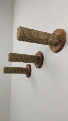 two wooden handles are hanging on the wall