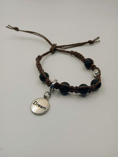 Hemp bracelet Black lava gemstones Charm that says dream Brown hemp Ties on Hemp Bracelet, Hemp Jewelry, Hemp Necklace, Hemp Bracelets, Bracelet Black, Macrame Jewelry, Beautiful Love, Wooden Beads, Arm Band