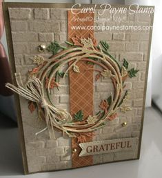 a close up of a card with a wreath on it