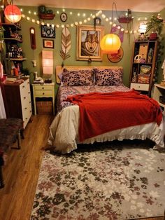 a bedroom decorated in green and red with lights strung above the bed, rugs on the floor