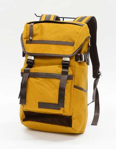 Description    yellow nylon backpack trimmed with leather; comfortable with an urban feel.    details    - nylon  - volume 16l  - width 26cm height 46cm diameter 19cm  - made in japan Large Luggage, The Cow, Leather Label, Drink Holder, Deep Colors, Men's Backpack, Milling, Cow Leather, Made In Japan