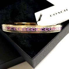 New Coach Women's Bangle Bracelet Plated Color Pink And Gold Coach Adjustable Bangle, Adjustable Coach Bangle, Coach Gold Bangle Bracelet, Coach Metal Bangle Jewelry, Coach Bangle Bracelets Gift, Trendy Pink Jewelry For Formal Occasions, Coach Silver Bangle Bracelets, Coach Silver Bangle Bracelet, Formal Adjustable Coach Bracelets