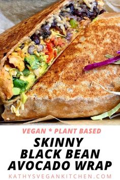 a close up of a sandwich cut in half with the text vegan plant based skinnyy black bean avocado wrap