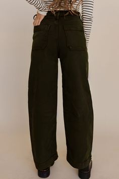 Introducing the versatile and chic Natalie Utility Pants by Just Black Denim. These high-waisted pants come in a unique olive green color and feature big pockets for added functionality. Made with a perfect fit and comfortable stretch, you'll love wearing these trendy pants for any occasion. Paired with THE ROSLYNN LONG SLEEVE KNIT TOP IN BLACK STRIPE Just Black Denim brand Front large utility pockets Back pockets High rise Wide cropped legs Zip and button closure Belt loops 96% cotton, 3% elast Happy Threads, Summer Goddess, Pink Desert, Long Sleeve Knit Top, Trendy Pants, Just Black, Big Pockets, Utility Pockets, Exclusive Clothing