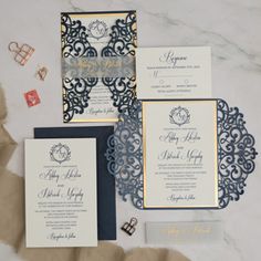 the wedding stationery is laid out on the table