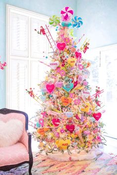 a brightly colored christmas tree in a living room