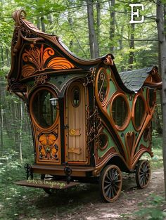 an old fashioned horse drawn carriage in the woods