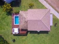 an aerial view of a house with a swimming pool