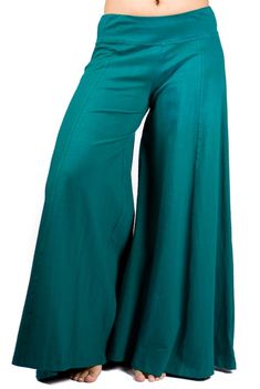 "Palazzo style pant, fitted at waist via elastic, flows out in an A-shape. Stretchy and comfortable. Long inseam and long legged. Looks like a skirt! Free flowing and wonderful to dance in. Pair with one of our crop tops for a classic Mishu style outfit! Approximate measurements: XS: Inseam: 29\" Hip: 34-40\" Waist:28-32\" Length 39\" S: Inseam: 30\" Hip: 36-42\" Waist:30-36\" Length 39\" M: Inseam: 31\" Hip: 38-46\" Waist: 32-40\" Length 39\" L: Inseam: 31\" Hip: 42-48\" Waist: 34-42\" Length 4 Green Full-length Bottoms For Fall, Green Full Length Bottoms For Fall, Loosely Fitted Green Wide Leg Pants For Fall, High-waist Cotton Bottoms With Wide Waistband, Chic Green Full Length Bottoms, Chic Full Length Green Bottoms, Versatile Full Length Spring Pants, Versatile Full Length Pants For Spring, Versatile Fitted Harem Pants For Summer