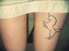 a woman's legs with a tattoo on the bottom of her leg and an outline of a horse