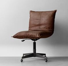 a brown leather office chair sitting on top of a metal base with wheels and casteors