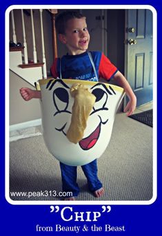 a young boy dressed as chip from beauty and the beast holding a large plastic cup