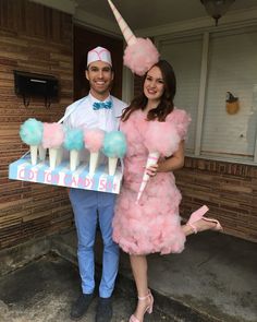 the man and woman are dressed up in pink and blue costumes for their birthday party