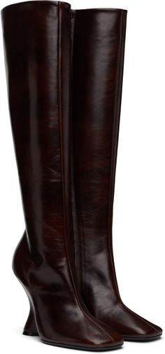 Knee-high grained calfskin boots in brown. · Square toe · Zip closure at inner side · Grained leather lining · Covered wedge heel with rubber injection · Polished calfskin sole · Heel: H4.25 Supplier color: Dark brown Luxury Brown Square Toe Knee-high Boots, Formal Brown Knee-high Boots With Reinforced Heel, Luxury Brown Knee-high Boots With Reinforced Heel, Luxury Brown Snip Toe Knee-high Boots, Brown Leather Wedges, Brown Knee-high Heeled Boots With Zipper, Brown Square, Leather Wedges, Boots Knee