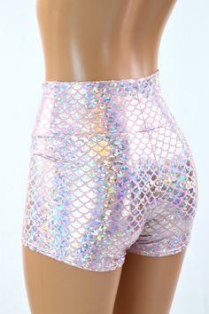 "This item is made to order, please read all the way through the listing before purchasing! Shiny silver scales sparkle with hologram shine on baby pink lycra spandex. Smooooooth and shiny, these stretchy little shorts are comfy and figure flaunting. The shorts have a high , anti muffin top waistband. LENGTH: 2.5\" inseam RISE: 11\" Womens Sizing (See below for instructions on where measurements should be taken) XXS: Bust 29\"-30\" / Waist 22\"-23\" / Hips 30\"-32\" Extra Small: Bust 31\"-32\" / Fitted Shiny Short Bottoms, Metallic Stretch Disco Shorts, Stretch Shiny Short Bottoms, Metallic Shiny Stretch Shorts, Metallic Disco Shorts For Summer, Fitted Shiny Shorts For Summer, Iridescent Stretch Bottoms For Summer, Pink Stretch Shorts For Party, Iridescent Fitted Disco Bottoms