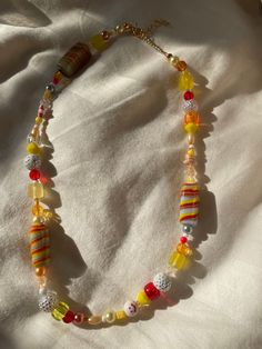 "★ The \"southern sunset\" necklace is bright, colorful, and perfect for summer ★Made with lamp-worked glass beads, acrylic pearls, seed beads and acrylic beads ★All necklaces come with a 2\" extension chain ★Please message me if you would like a different length" Tiny Yellow Beads For Summer, Yellow Beaded Necklaces For Beach, Unique Orange Beaded Necklace With Colorful Beads, Yellow Round Bead Necklaces For Summer, Unique Yellow Beaded Necklaces For Festival, Unique Orange Beaded Necklace, Yellow Round Beads Necklace For Summer, Unique Yellow Beaded Necklace For Festivals, Summer Yellow Beaded Necklaces With Large Beads