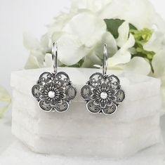 925 Sterling Silver Handmade Artisan Crafted Filigree Flower Earrings   Matching ring is available. https://www.etsy.com/listing/1064044313/daisy-flower-silver-ring925-sterling Material: 925 Solid Sterling Silver, 925 Stamped Earrings Length: 1.20 inches Width: 0.75 inches Finishing: Oxidized and Polished Comes with a gift pouch and box Free Domestic Shipping We hope that you enjoy our exclusive artisan handcrafted jewelry. Artisan Sterling Silver Wedding Earrings, Flower Shaped Oxidized Jewelry As Gift, Traditional Sterling Silver Flower-shaped Earrings, Traditional Sterling Silver Earrings In Flower Shape, Flower Shaped Oxidized Jewelry Gift, Traditional Sterling Silver Flower Shaped Earrings, Ornate White Bridal Earrings As Gift, Traditional Sterling Silver Flower Earrings For Gift, Intricate Flower-shaped Earrings For Gift