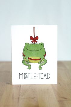 a card with a frog on it that says, mistle - toad