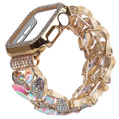 a gold apple watch with lots of colorful jewels on it's face and bracelet