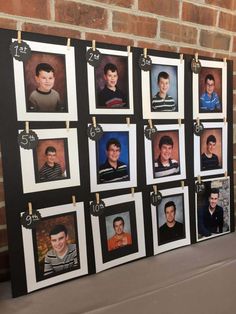 a bulletin board with pictures of young men hanging on clothes pegs and pinned to the wall