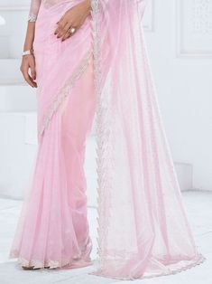 Introducing our stunning "bewitching baby pink swarovski work organza party wear saree," a truly mesmerizing piece that exudes charm and elegance. Made from high-quality organza material in a beautiful baby pink color, this saree is adorned with exquisite Swarovski work all over and features a heavy handwork border for a touch of sophistication. The set also includes a matching organza blouse with zircon work, completing the look effortlessly.
Not only does it offer a timeless and classic appeal Engagement Gown, Organza Material, Lehenga Crop Top, Lehenga Choli Wedding, Baby Pink Color, Floral Lehenga, Party Wear Lehenga Choli, Reception Gown, Bollywood Lehenga