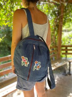 A lovely backpack for everyday use. Our collection includes a variety of designs to suit your style. Made out of denim. Not only eco-friendly but also fashionable, featuring trendy designs that will make you stand out. Approximate dimensions of the backpack: Width: 33 cm Height: 40 cm Handle: 75 cm This is 100% handmade that has variations of colours, texture. Small imperfections/differences in shape, size and colour can happen and are part of the charm of a handmade product. Please do not hesitate to contact me with your questions. Flowers, Cross Stitch, Denim Backpack, Large soft denim Backpack bag, Casual Backpack, Daily Backpack, Travel Backpack, School Backpack, Laptop Bag, Notebook Bag Summer Cotton Backpack For Daily Use, Trendy Embroidered Backpack For Everyday Use, Trendy Embroidered Backpack For Travel, Casual Embroidered Backpack For Daily Use, Summer Backpack With Pockets For Daily Use, Casual Embroidered Backpack For Everyday Use, Summer Backpack For Daily Use With Pockets, Summer Daily Use Backpack With Pockets, Casual Rectangular Backpack As Gift