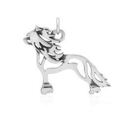 a silver charm with a horse on it's back end and an inscription that reads,