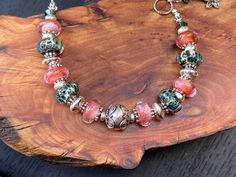 Peach Orchard Lampwork Bracelet Pink Bracelet Green - Etsy Handmade Peach Bracelets With Round Beads, Handmade Peach Beaded Bracelets For Gift, Handmade Peach Beaded Bracelets As Gift, Adjustable Peach Beaded Bracelet As Gift, Handmade Peach Bracelet Gift, Adjustable Peach Beaded Bracelets As Gift, Peach Round Beads Bracelet As Gift, Handmade Adjustable Peach Bracelets, Peach Bohemian Bracelet For Gift