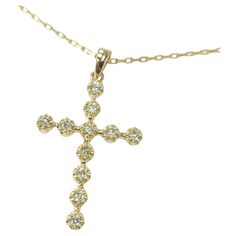 A precious interpretation of a classic motif, this exquisite Diamond Cross Pendant is handcrafted from 18 karat gold and glistens with diamonds. This pendant is a 0.28 total carats of natural diamonds. (Necklace not included). The cross with the bale measures 1.1 inch long and is .75 inches wide. This is handmade and one of a kind. Diamonds Necklace, Diamond Cross Pendants, Diamond Cross, Cross Jewelry, Round Cut Diamond, Cross Pendant, Round Cut, Natural Diamonds, Jewelry Necklace Pendant