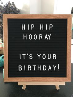 a sign that says hip hooray it's your birthday on the table