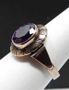 We originally sold this and got it back in on trade. Quite a beautiful old ring. A bezel set 1+ct amethyst in an oval cut. Remarkable condition. 16mm's north-south. This has been sized and marking are gone. Tested at the auction house and us as well. 2.84 dwt. Old Rings, North South, Yellow Gold Ring, Bezel Setting, Yellow Gold Rings, Rings Statement, Oval Cut, Gold Ring, Statement Rings