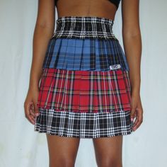 Introducing our three-layer tartan skirt, a harmonious blend of style and comfort. The elastic waistband ensures a perfect fit, while the layers showcase a dynamic interplay of black, red, and faded blue tartan. Elevate your wardrobe with this almost midi skirt, featuring a chic red zip closure at the back for a touch School Uniform Fashion, Tartan Skirt, Blue Tartan, Uniform Fashion, Three Layer, Tartan, Black Red, Midi Skirt, Perfect Fit