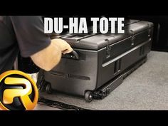 there is a black suitcase on wheels with the words du - ha tote written above it