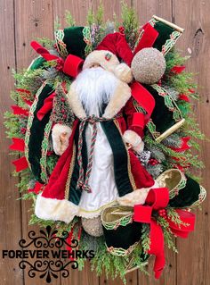 a christmas wreath with santa claus on it