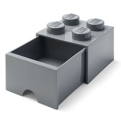 a gray lego storage box with four grey knobs