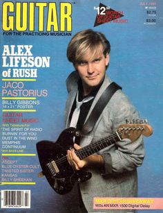 a magazine cover with a man playing an electric guitar