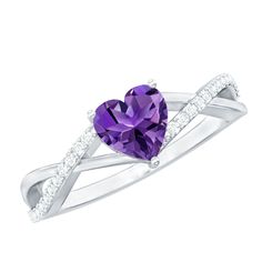 Product Details Discover the allure of the Heart Shape Amethyst Ring, a masterpiece of elegance and sophistication. This stunning ring features 6 MM Heart Shaped Amethyst celebrated for its deep, enchanting purple hue and remarkable clarity. The gemstone is elegantly set in a delicate, Prong Setting that maximizes its brilliant sparkle. The design is further enhanced by a graceful crossover band studded with Diamond, which intertwines in a dynamic and contemporary fashion. This crossover design Elegant Amethyst Rings For Valentine's Day, Purple Brilliant Cut Rings For Promise, Purple Heart Cut Fine Jewelry Ring, Purple Heart Cut Ring With Center Stone, Elegant Purple Heart Cut Ring, Elegant Amethyst Heart Cut Ring, Heart Shaped Amethyst, Promise Ring For Her, Crossover Ring